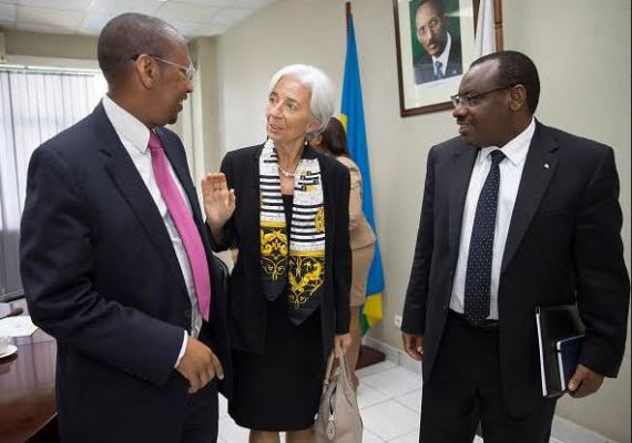 IMF Chief Christine Lagarde (c) during her visit to Rwanda in 2015, interacts with Finance Minister Claver Gatete and Governor John Rwangombwa of the National Bank of Rwanda